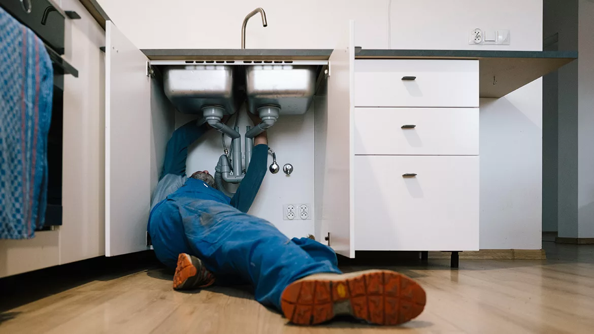 Plumber Repairing Drain