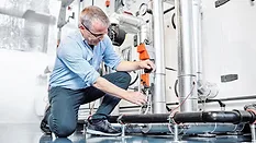 technician working on a valve