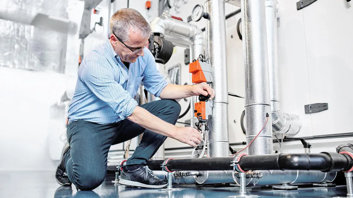 technician working on a valve