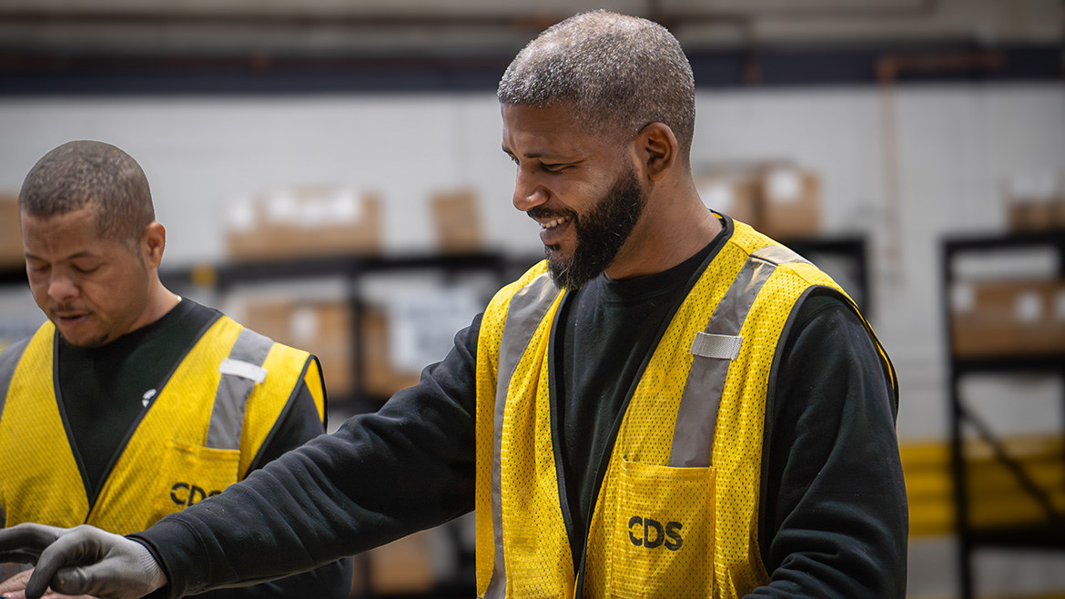 Team members connect on the distribution center floor