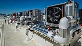 Fans and ducting for ventilation in a rooftop HVAC system.