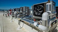 Rooftop Water Heaters Fans and ducting for ventilation in a rooftop HVAC system.