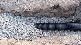Buried Sewer Line in Road Construction