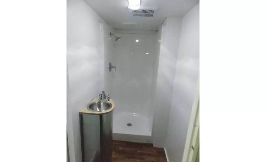 The truck features three sink and shower units