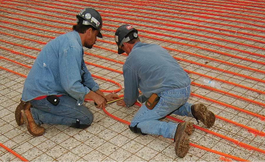 Installers in Missouri lay out and attach miles of Watts Radiant tubing
