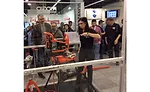 Trade visitors watch a product demo at the RIDGID Tool