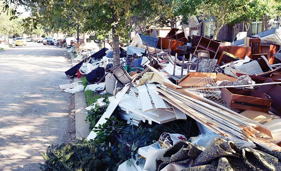 Ruined possessions line this middle-class neighborhood street