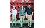 From left: Brothers Rick, Tom, and Mike Meek pose in the Western Training Facility (WTF)