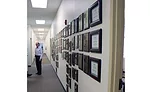 One wall of a hallway at TM Sales’ headquarters in Arvada, Colorado