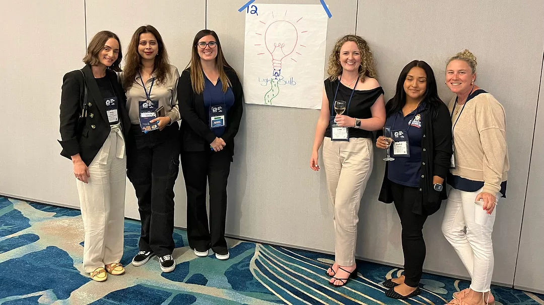 Nexstar Network members next to their drawing of what they think a leader should look like.