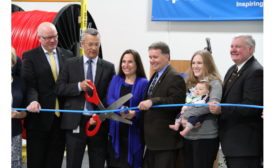 Uponor ribbon-cutting for building expansion