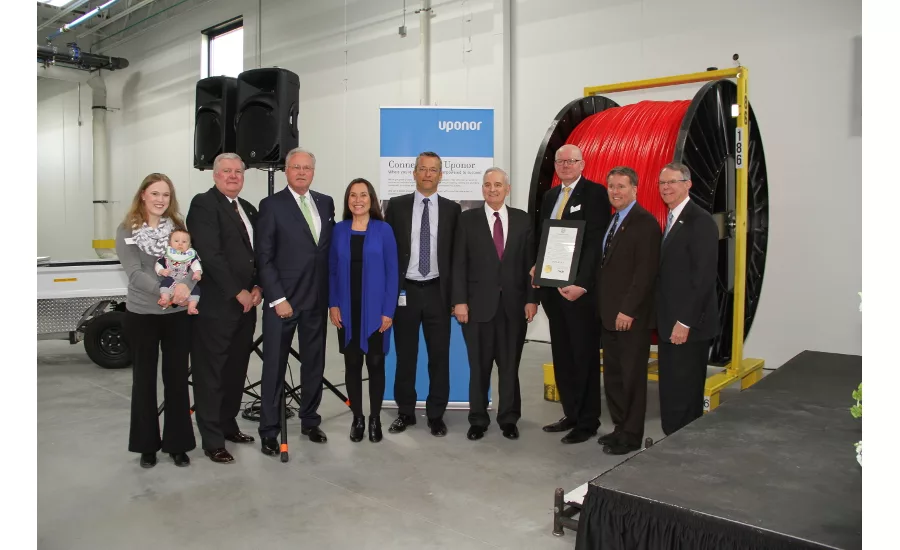 Uponor ribbon-cutting for building expansion 2